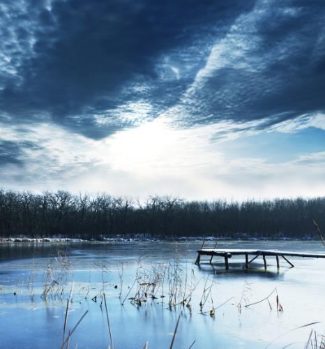Frozen Lake Under Dramatic Sky