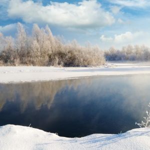 Frosted Riverbank with Blue Sky